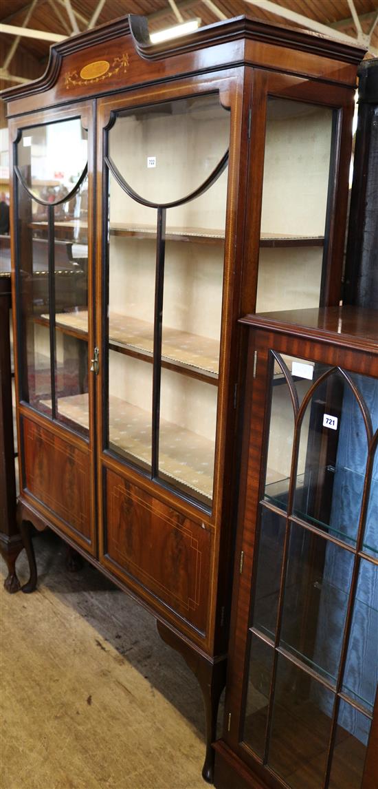 A 1920s inlaid mahogany display cabinet